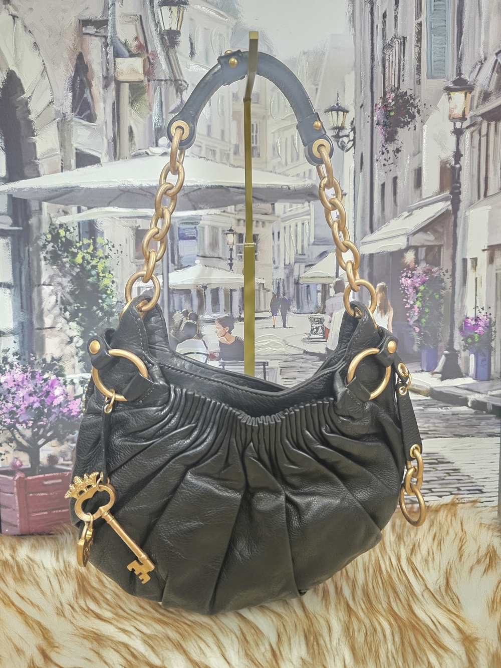 Vintage Juicy Couture in black leather shoulder bag.